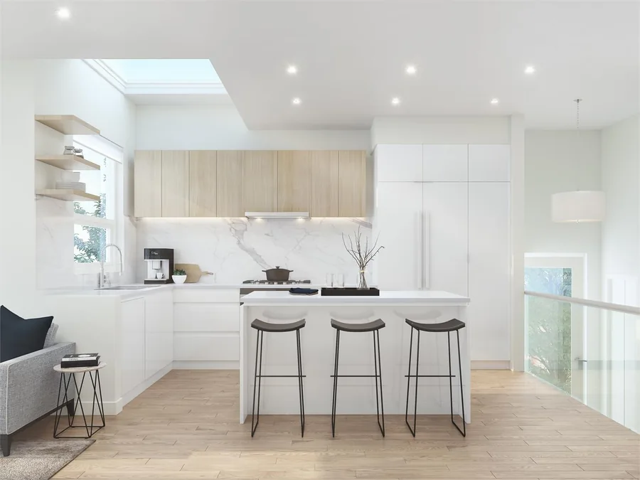 Bright kitchen with pale wood upper cabinetry and a slim white island.